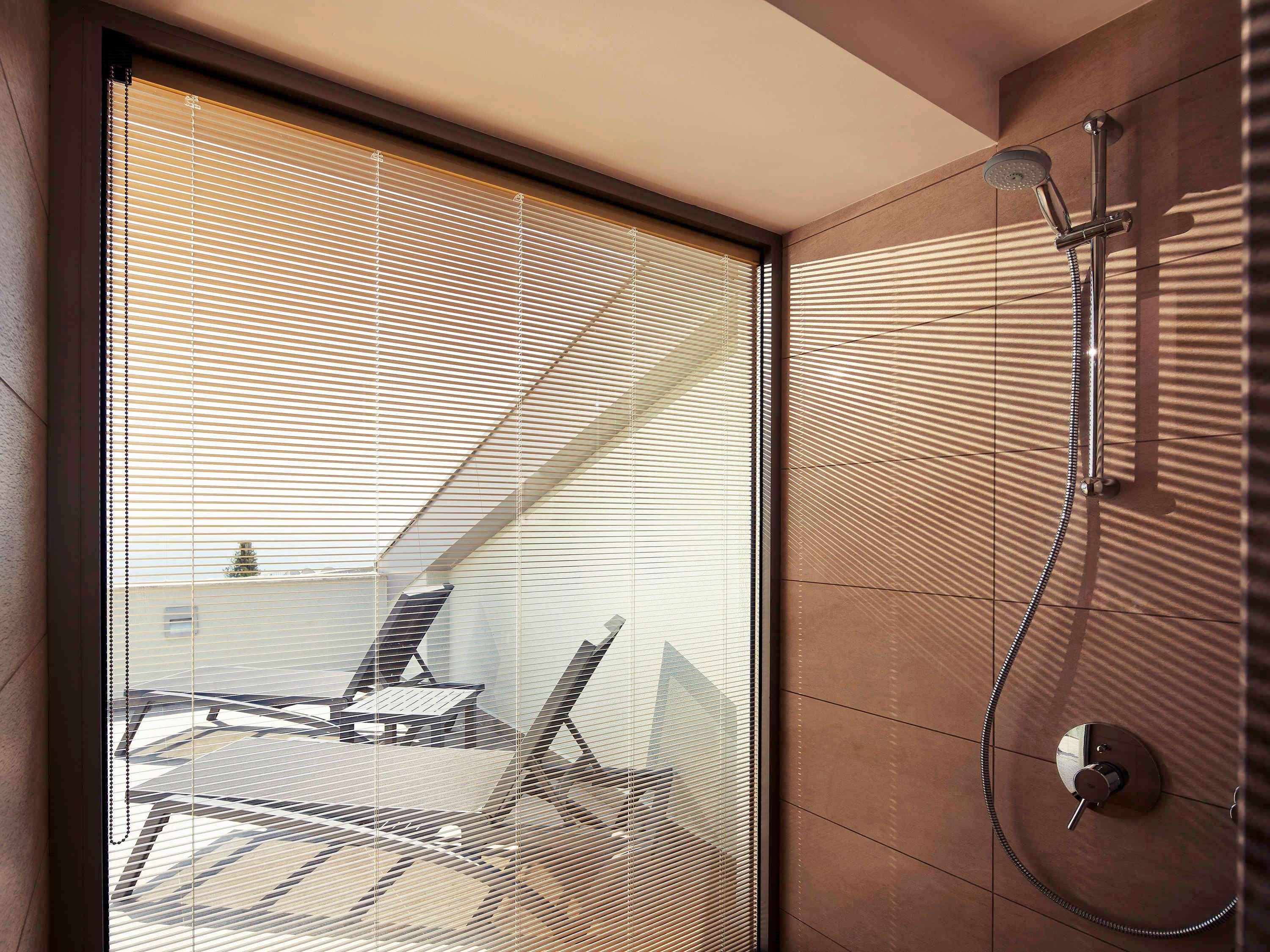 The Artisan Istanbul Mgallery Exterior photo A shower with a fixed shower head and handheld shower head